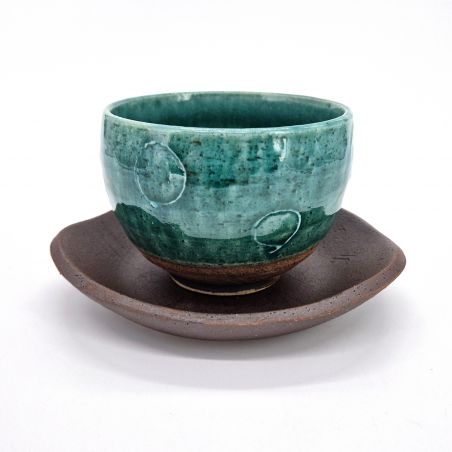 Japanese cup in blue clay and circle patterns with saucer